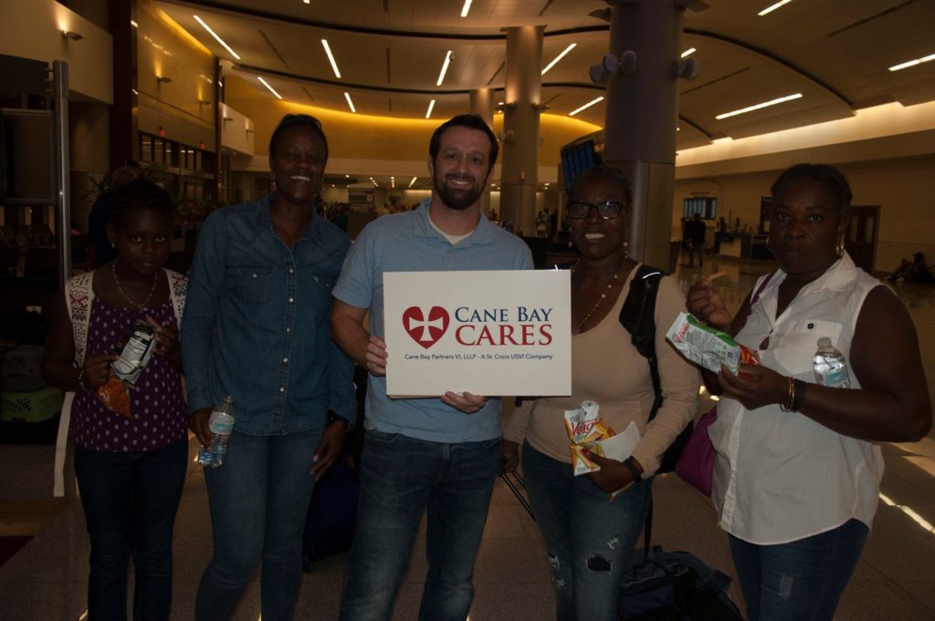 Cane Bay Partners employees volunteer to greet fellow employees and other evacuees from St. Croix to Altanta.