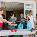 Cane Bay Partners volunteers distribute several thousand pounds of food, hundreds of LUCI solar lights and 6 pallets of water donated by St. Croix Foundation at Zion Christian Academy on Saturday, Nov. 11. Photo credit: Nicole Canegata http://nicolecanegata.com/