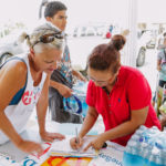 Cane Bay Partners volunteers distribute several thousand pounds of food, hundreds of LUCI solar lights and 6 pallets of water donated by St. Croix Foundation at Zion Christian Academy on Saturday, Nov. 11. Photo credit: Nicole Canegata http://nicolecanegata.com/