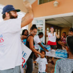Cane Bay Partners volunteers distribute several thousand pounds of food, hundreds of LUCI solar lights and 6 pallets of water donated by St. Croix Foundation at Zion Christian Academy on Saturday, Nov. 11. Photo credit: Nicole Canegata http://nicolecanegata.com/