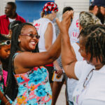 Cane Bay Partners volunteers distribute several thousand pounds of food, hundreds of LUCI solar lights and 6 pallets of water donated by St. Croix Foundation at Zion Christian Academy on Saturday, Nov. 11. Photo credit: Nicole Canegata http://nicolecanegata.com/