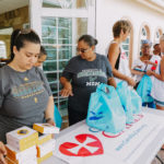 Cane Bay Partners volunteers distribute several thousand pounds of food, hundreds of LUCI solar lights and 6 pallets of water donated by St. Croix Foundation at Zion Christian Academy on Saturday, Nov. 11. Photo credit: Nicole Canegata http://nicolecanegata.com/