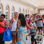 Cane Bay Partners volunteers distribute several thousand pounds of food, hundreds of LUCI solar lights and 6 pallets of water donated by St. Croix Foundation at Zion Christian Academy on Saturday, Nov. 11. Photo credit: Nicole Canegata http://nicolecanegata.com/