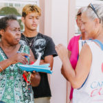 Cane Bay Partners volunteers distribute several thousand pounds of food, hundreds of LUCI solar lights and 6 pallets of water donated by St. Croix Foundation at Zion Christian Academy on Saturday, Nov. 11. Photo credit: Nicole Canegata http://nicolecanegata.com/