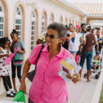 Cane Bay Partners volunteers distribute several thousand pounds of food, hundreds of LUCI solar lights and 6 pallets of water donated by St. Croix Foundation at Zion Christian Academy on Saturday, Nov. 11. Photo credit: Nicole Canegata http://nicolecanegata.com/