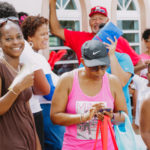 Cane Bay Partners volunteers distribute several thousand pounds of food, hundreds of LUCI solar lights and 6 pallets of water donated by St. Croix Foundation at Zion Christian Academy on Saturday, Nov. 11. Photo credit: Nicole Canegata http://nicolecanegata.com/