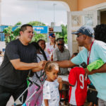 Cane Bay Partners volunteers distribute several thousand pounds of food, hundreds of LUCI solar lights and 6 pallets of water donated by St. Croix Foundation at Zion Christian Academy on Saturday, Nov. 11. Photo credit: Nicole Canegata http://nicolecanegata.com/