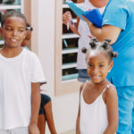 Cane Bay Partners volunteers distribute several thousand pounds of food, hundreds of LUCI solar lights and 6 pallets of water donated by St. Croix Foundation at Zion Christian Academy on Saturday, Nov. 11. Photo credit: Nicole Canegata http://nicolecanegata.com/