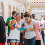 Cane Bay Partners volunteers distribute several thousand pounds of food, hundreds of LUCI solar lights and 6 pallets of water donated by St. Croix Foundation at Zion Christian Academy on Saturday, Nov. 11. Photo credit: Nicole Canegata http://nicolecanegata.com/