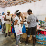 750 individuals and families received overflowing bags of food from Cane Bay Cares ahead of the Thanksgiving holiday Tuesday, Nov. 21 at Foundation Ministries. Photo credit: Nicole Canegata http://nicolecanegata.com/