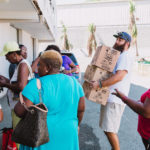 750 individuals and families received overflowing bags of food from Cane Bay Cares ahead of the Thanksgiving holiday Tuesday, Nov. 21 at Foundation Ministries. Photo credit: Nicole Canegata http://nicolecanegata.com/
