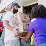 750 individuals and families received overflowing bags of food from Cane Bay Cares ahead of the Thanksgiving holiday Tuesday, Nov. 21 at Foundation Ministries. Photo credit: Nicole Canegata http://nicolecanegata.com/