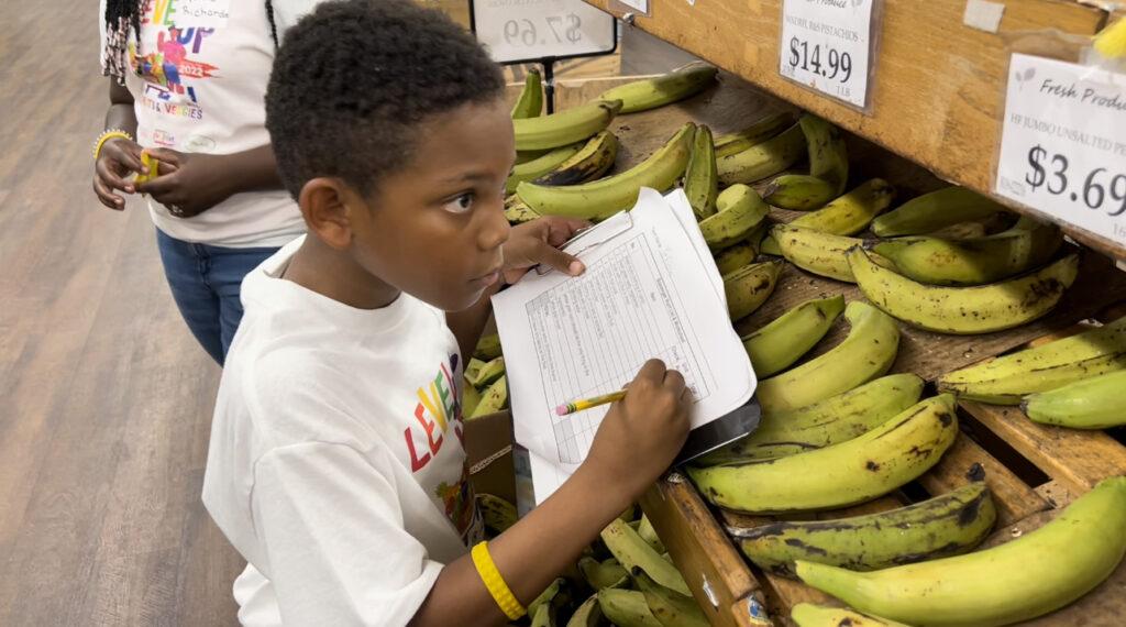 Jaheem Francis participates in a reinvented "Supermarket Sweep" for preteens hosted by Cane Bay Cares and Operation Inspire