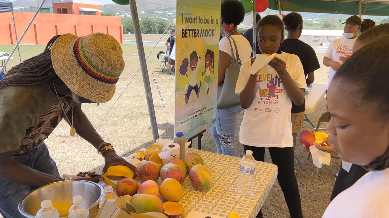 VI Department of Agriculture Commissioner Terrence "Positive" Nelson participates in the "Level Up with Fruits and Veggies" Nutrition Fair for preteens hosted by Cane Bay Cares.